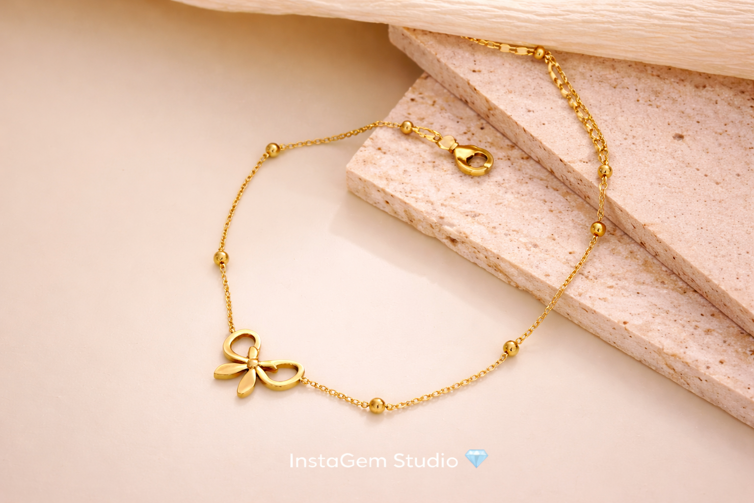 Delicate gold bow bracelet